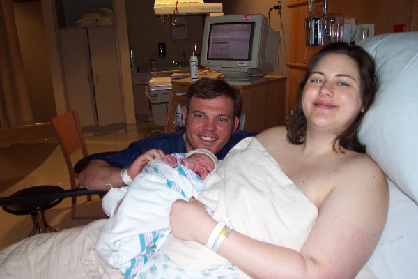 Alex 
and his happy parents in the hospital